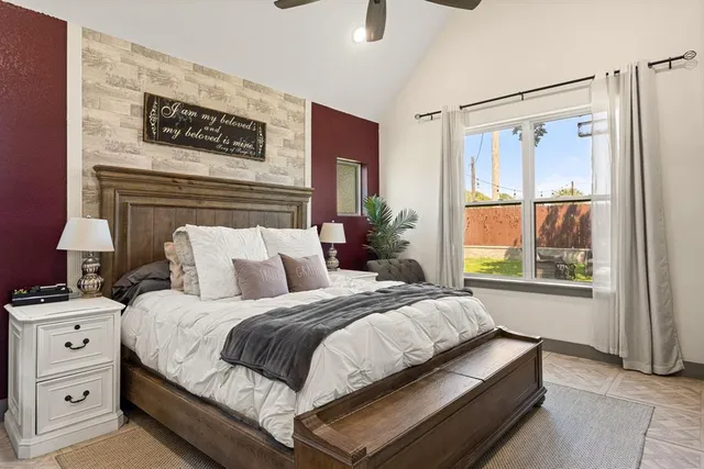 a bedroom with bed and a window