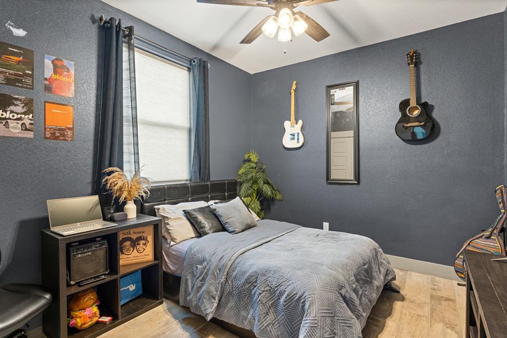 2000 Rattler Way Tolar, TX 76476 - Photo 19 of 33 a bedroom with a bed and wooden floor