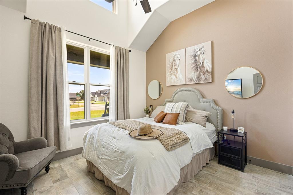 2000 Rattler Way Tolar, TX 76476 - Photo 21 of 33 a bedroom with bed and a window