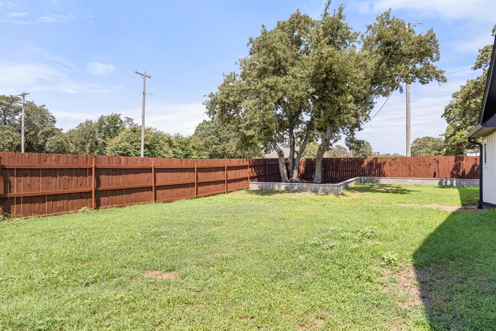 2000 Rattler Way Tolar, TX 76476 - Photo 25 of 33 a view of backyard with wooden fence