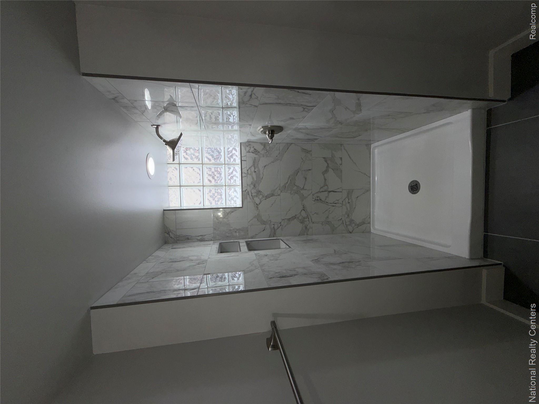 16522 Inverness Street Detroit, MI 48221 - Photo 46 of 62 Basement Bathroom with a marble finish shower and baseboards