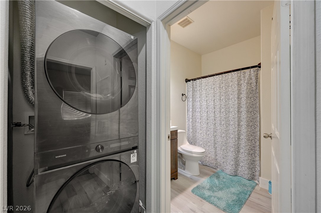 4730 East Craig Road, Unit 1155 Las Vegas, NV 89115 - Photo 15 of 41 Functional laundry appliances tucked away beside a bright, accessible bathroom.