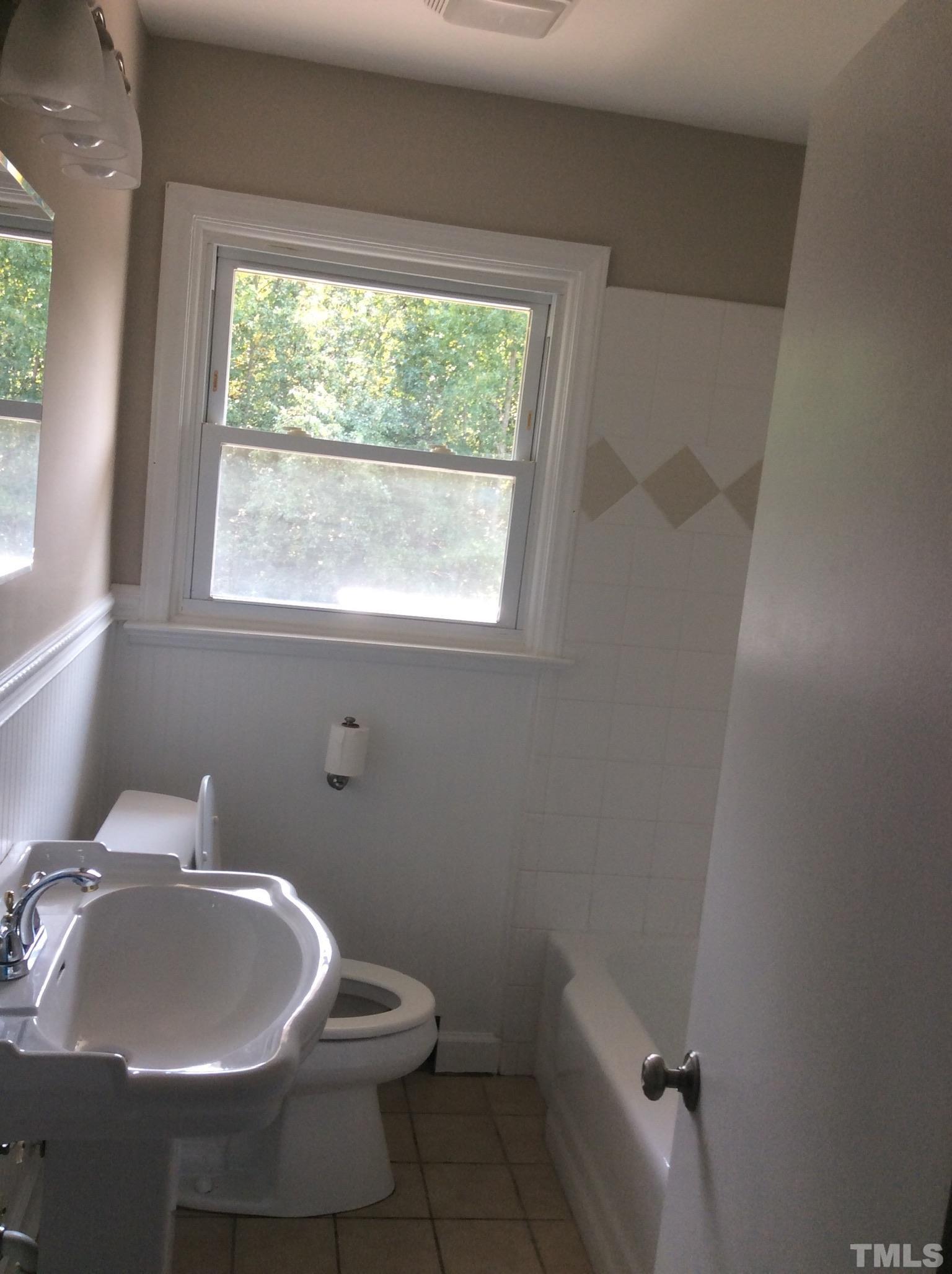 3424 Moriah Road Rougemont, NC 27572 - Photo 17 of 20 a bathroom with a sink toilet and a window