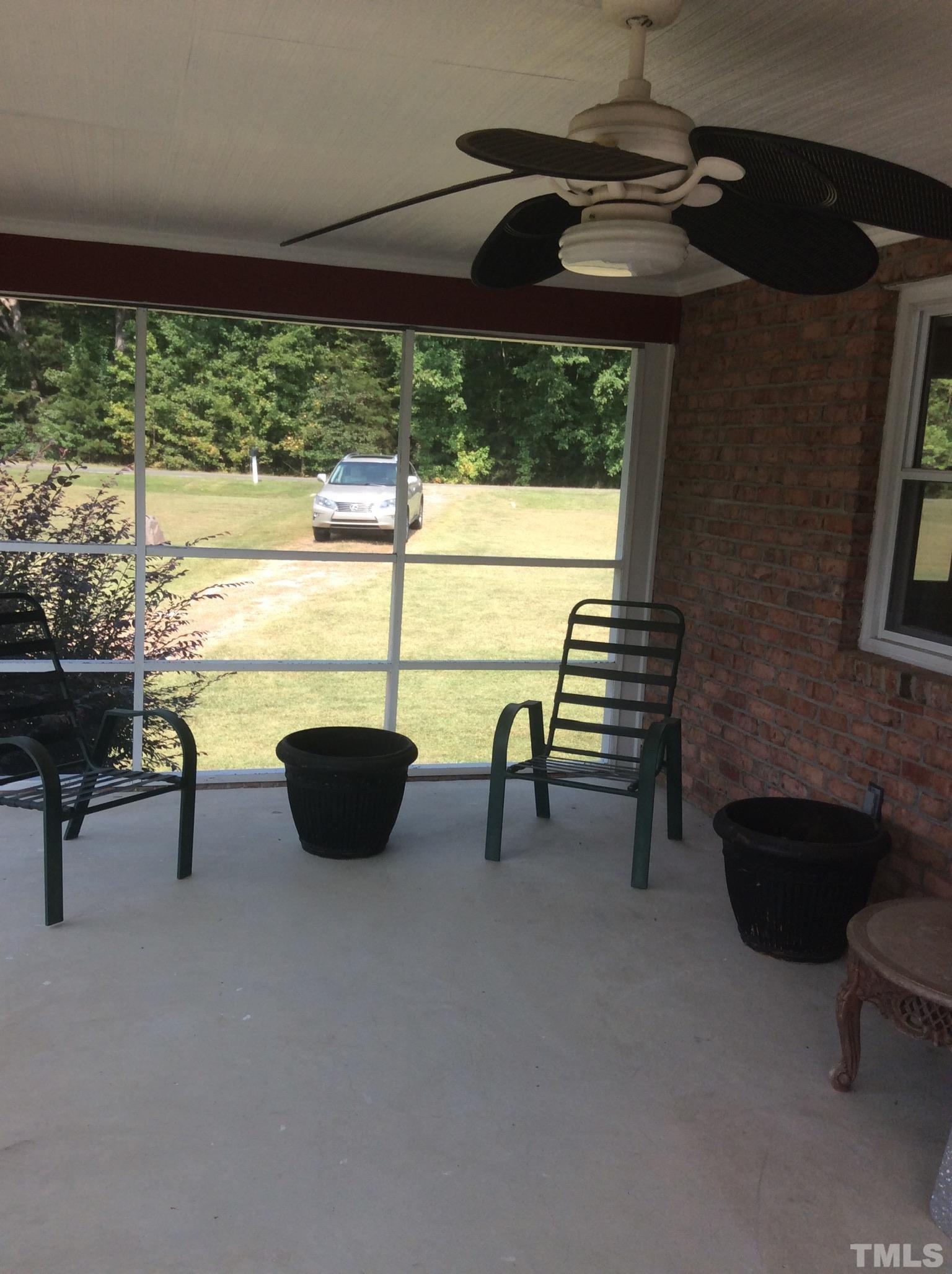 3424 Moriah Road Rougemont, NC 27572 - Photo 19 of 20 a view of a chairs and table in patio