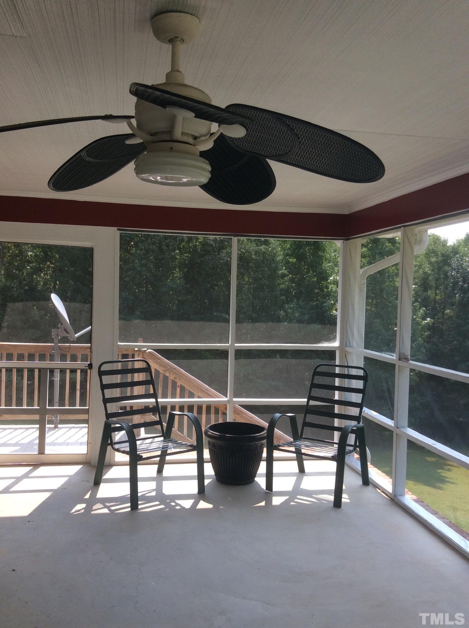 3424 Moriah Road Rougemont, NC 27572 - Photo 20 of 20 a view of a porch with furniture and floor to ceiling window