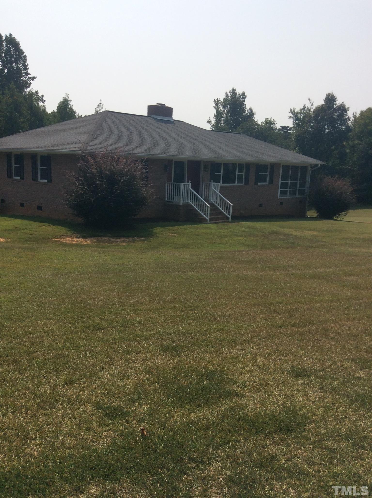 3424 Moriah Road Rougemont, NC 27572 - Photo 4 of 20 a view of a house with a garden