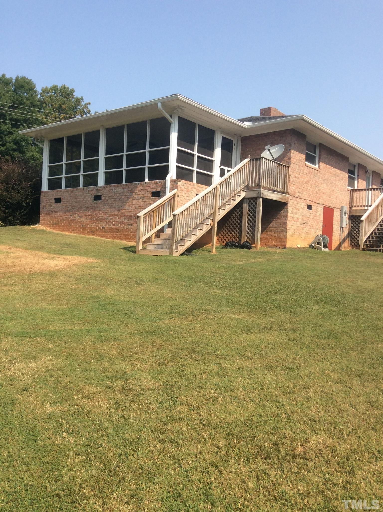 3424 Moriah Road Rougemont, NC 27572 - Photo 5 of 20 a view of a house with a backyard and windows