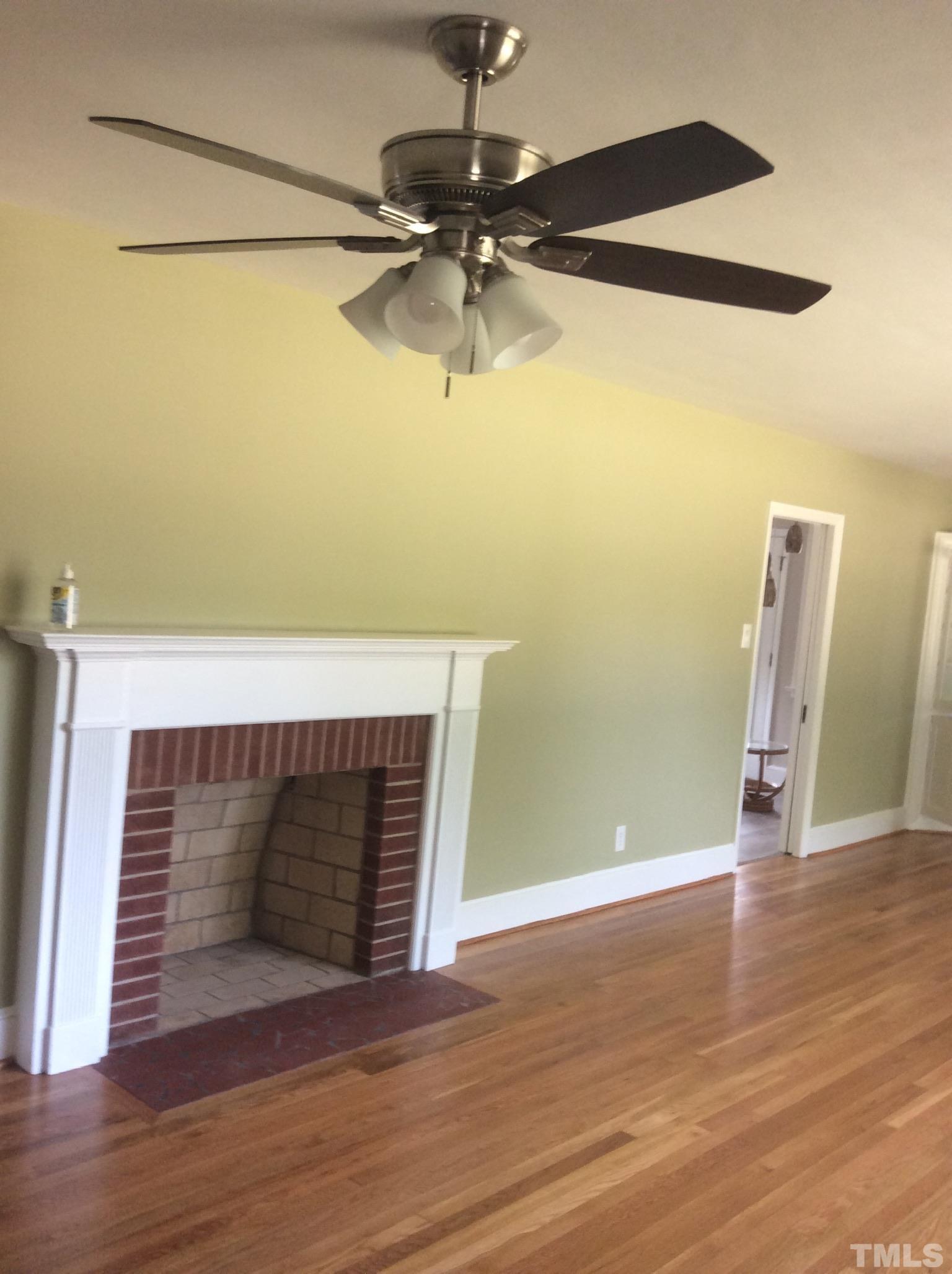 3424 Moriah Road Rougemont, NC 27572 - Photo 8 of 20 a view of a room with wooden floor and a ceiling fan