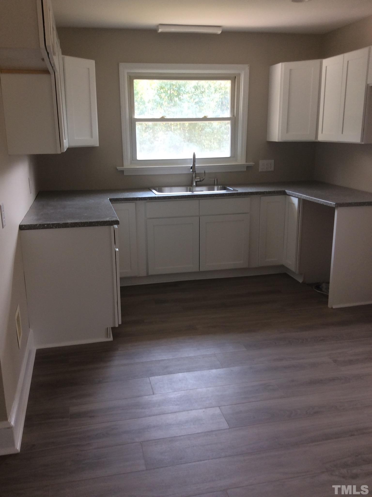3424 Moriah Road Rougemont, NC 27572 - Photo 10 of 20 a kitchen with a sink cabinets and a window