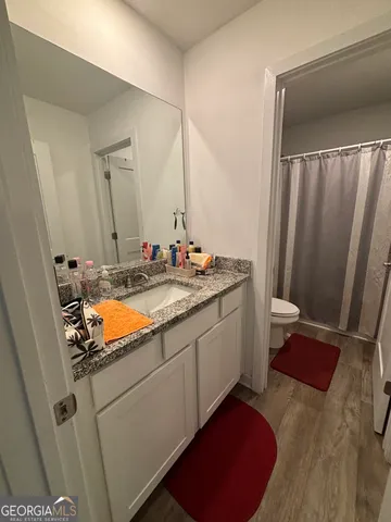 a bathroom with sink and mirror