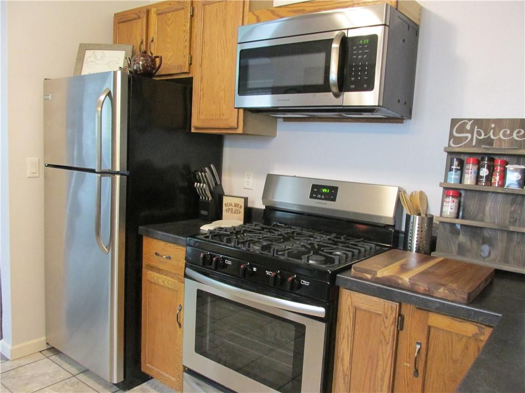 421 Mercer Road Greenville, PA 16125 - Photo 14 of 25 a kitchen with a stove and a microwave