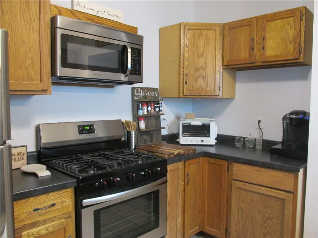 421 Mercer Road Greenville, PA 16125 - Photo 15 of 25 a kitchen with stainless steel appliances granite countertop a stove and a microwave