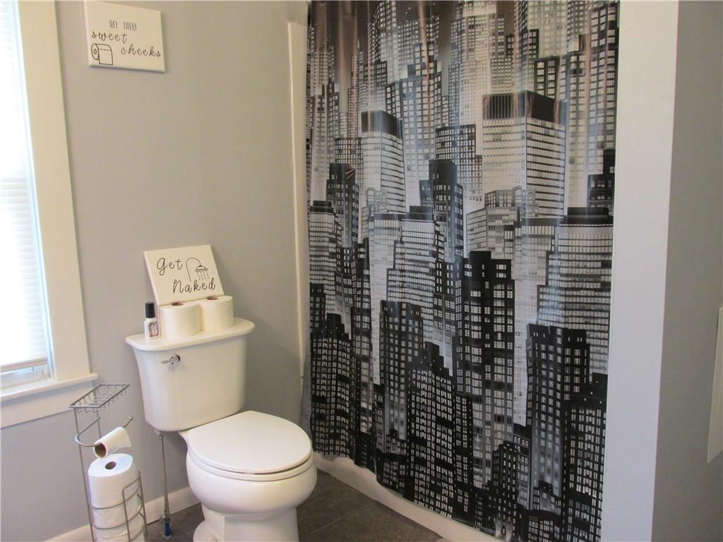 421 Mercer Road Greenville, PA 16125 - Photo 23 of 25 a bathroom with a toilet and a shower curtain