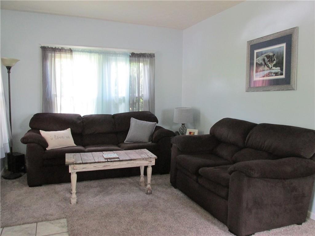 421 Mercer Road Greenville, PA 16125 - Photo 8 of 25 a living room with furniture and a window