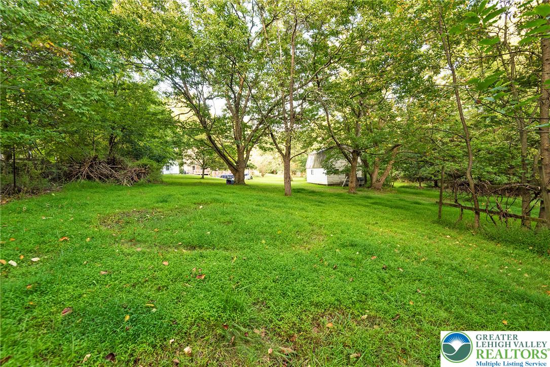 1114 Fox Gap Road Bangor, PA 18013 - Photo 41 of 63 Mature trees shade a spacious grassy clearing complete with an outbuilding on the property.