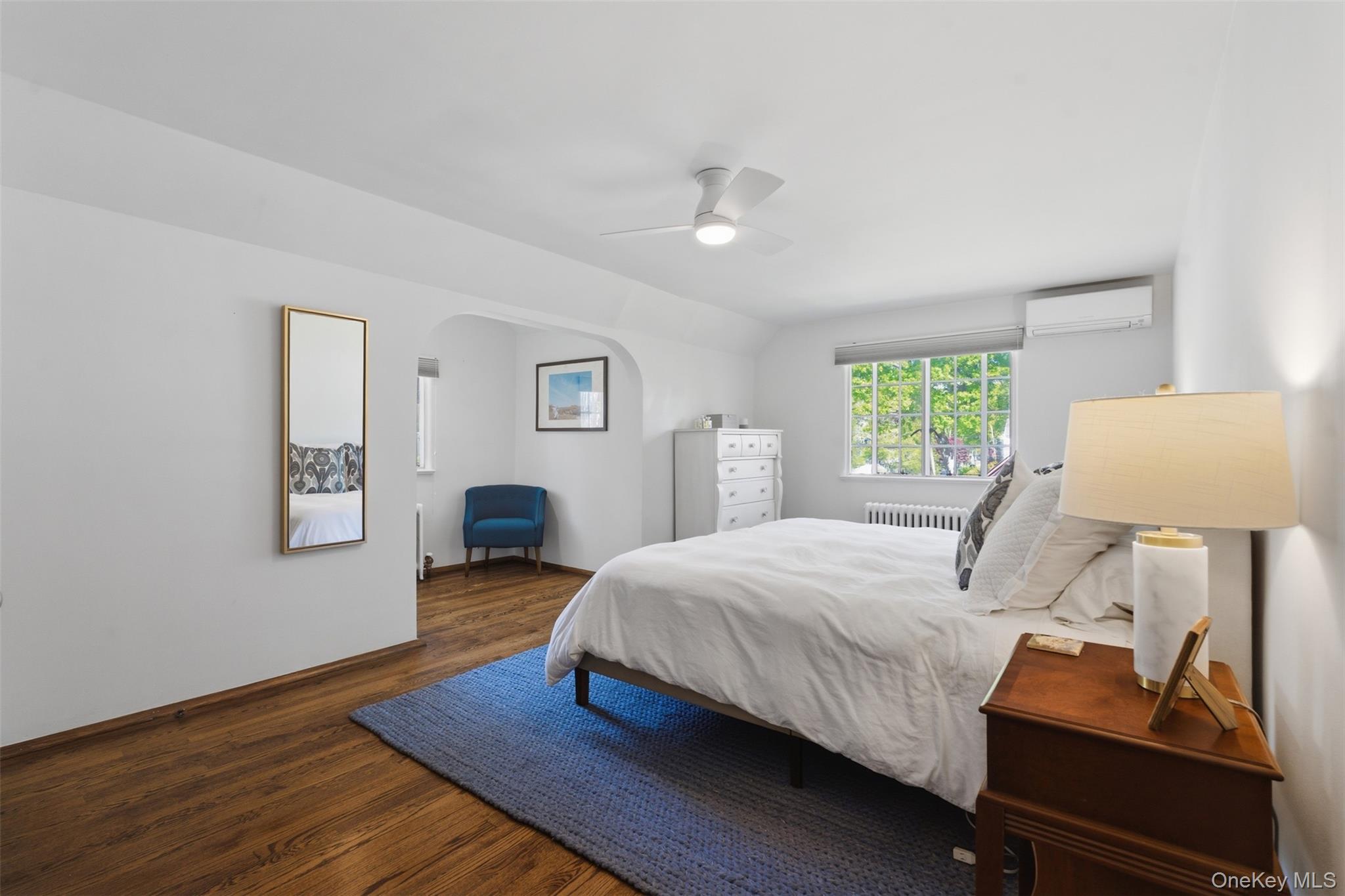 15 Kingsbury Road New Rochelle, NY 10804 - Photo 16 of 30 a bedroom with a bed and a lamp with window