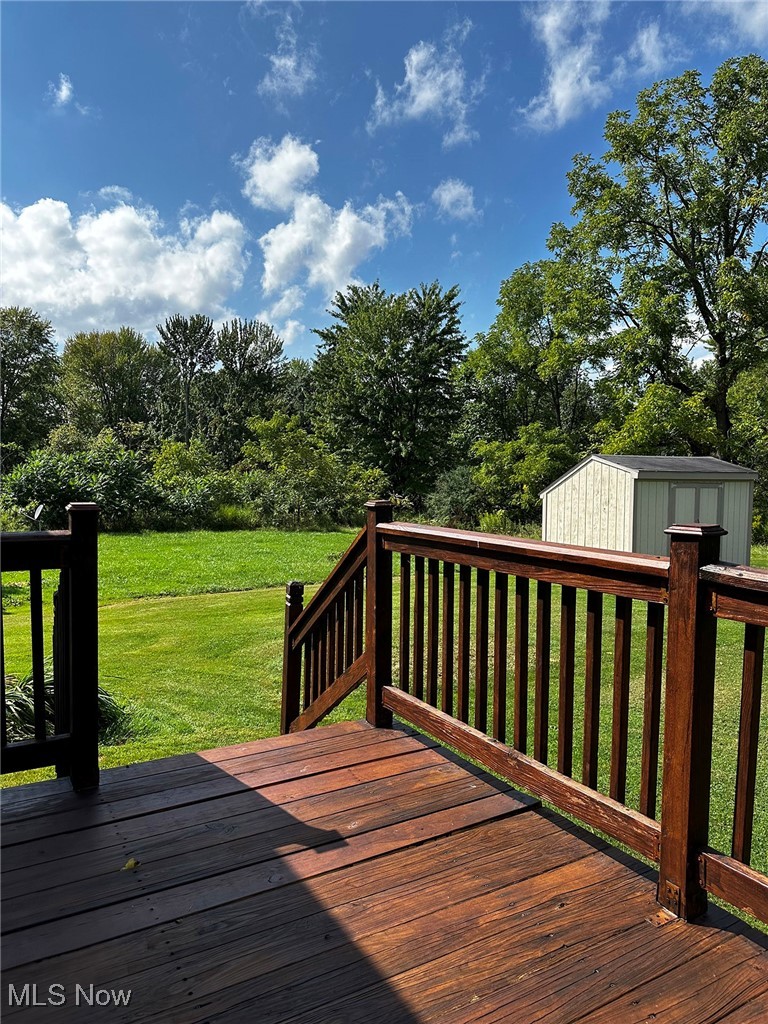 347 Brownville Road Rome, OH 44085 - Photo 6 of 36 Wooden terrace with a yard and a storage unit