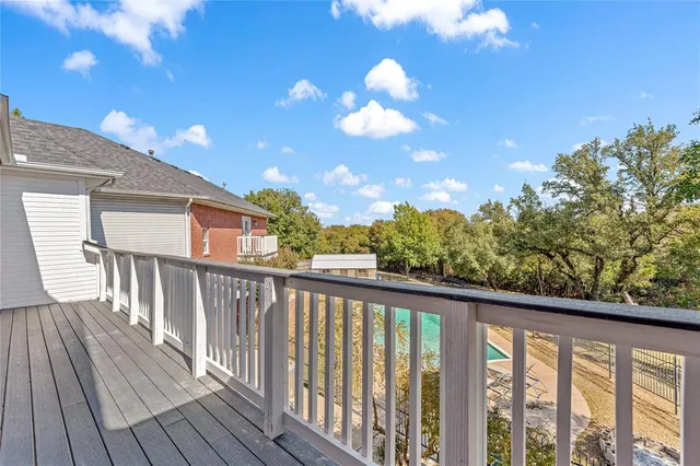 a view of a balcony with wooden floor