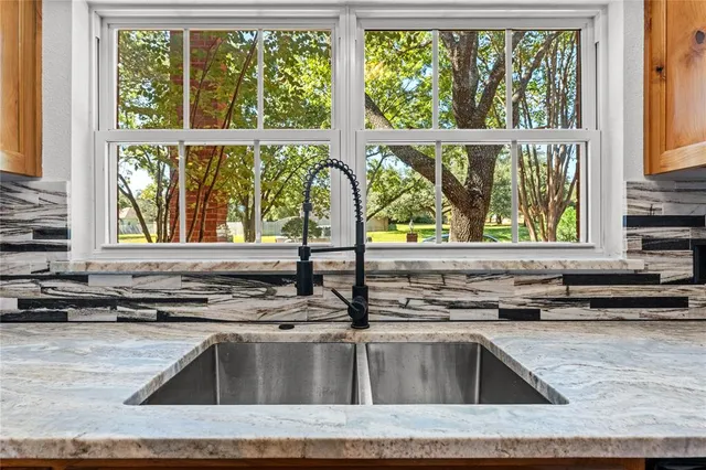 a kitchen with a sink and a window