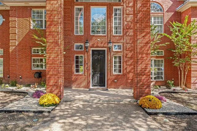 a front view of a building with many windows