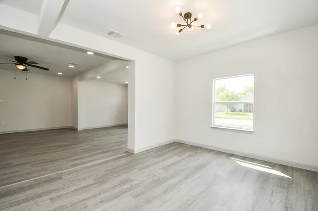 a kitchen that has a sink and a stove in it