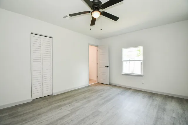 wooden floor in an empty room and a window