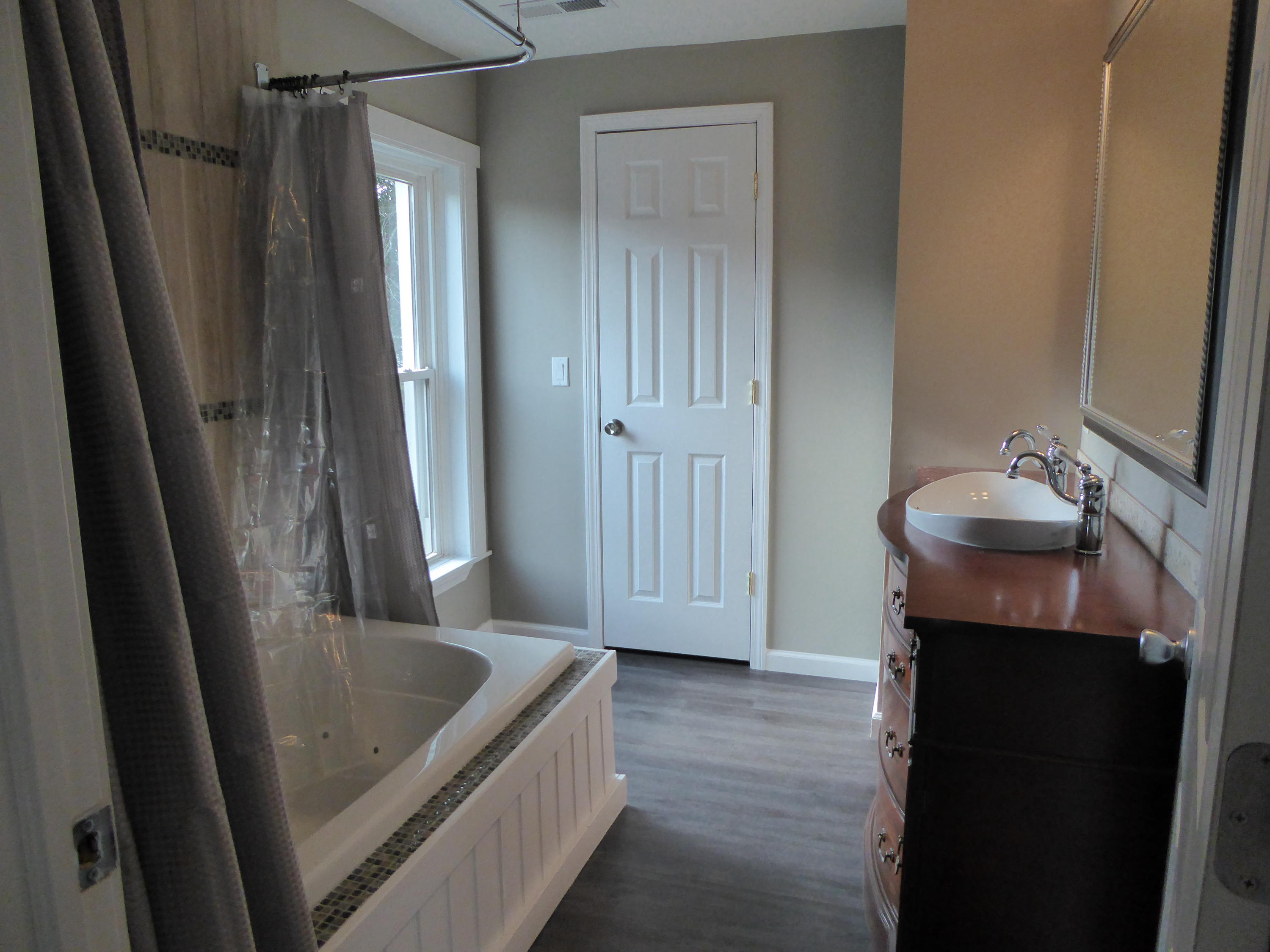 790 Factory Hill Road Callaway, VA 24067 - Photo 22 of 44 a bathroom with a tub sink and vanity