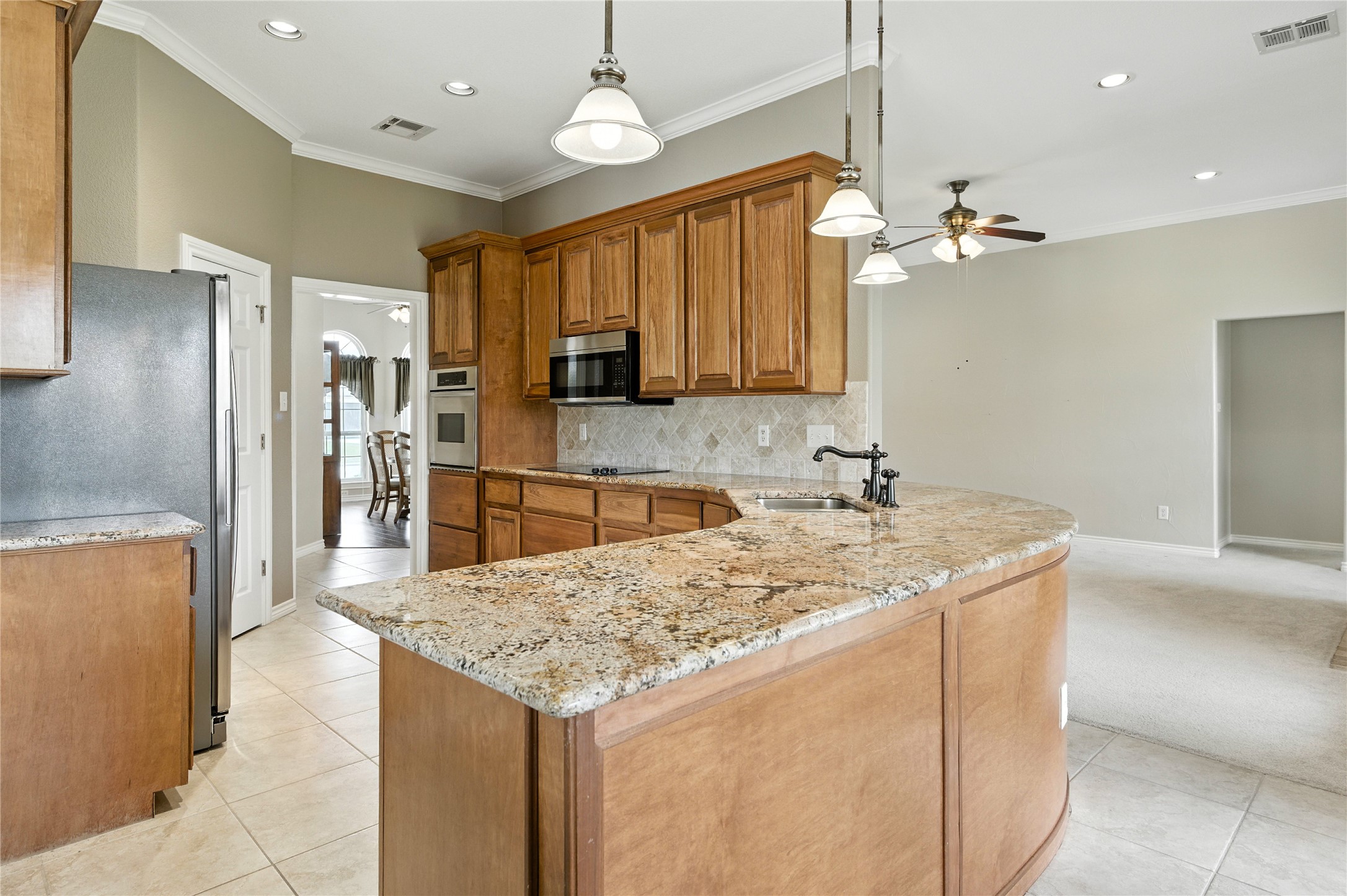 100 Davis Court Thorndale, TX 76577 - Photo 20 of 39 Open concept with recessed remote controlled lighting, views of both living areas.
