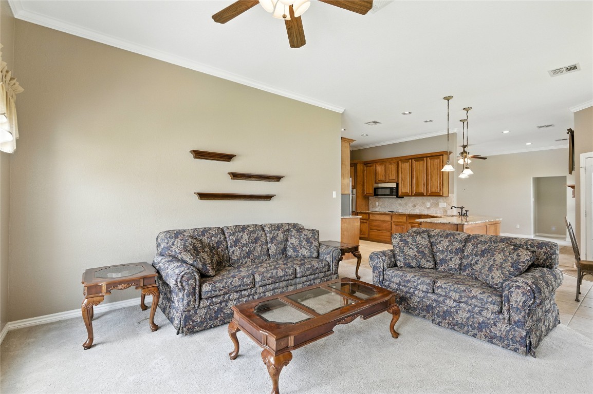 100 Davis Court Thorndale, TX 76577 - Photo 32 of 39 a living room with furniture a couch and a ceiling fan