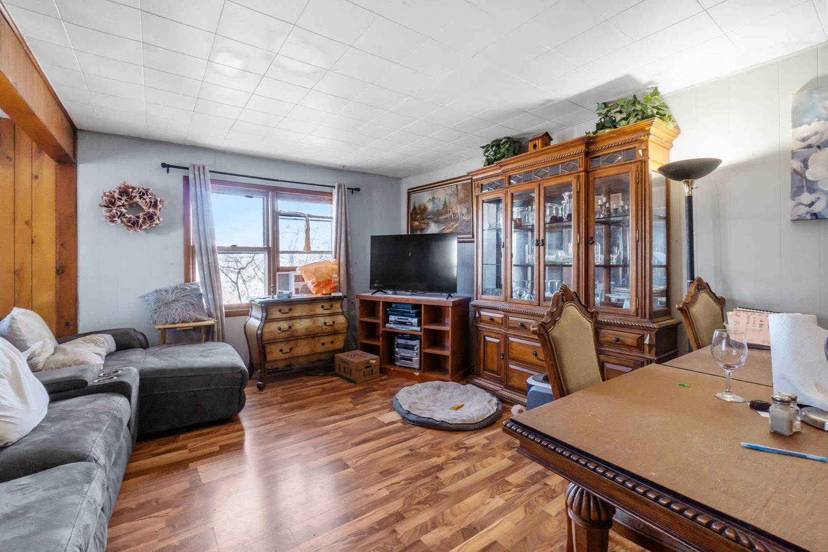 11505 Lakeview Road Richmond, IL 60071 - Photo 6 of 22 a living room with furniture and a flat screen tv