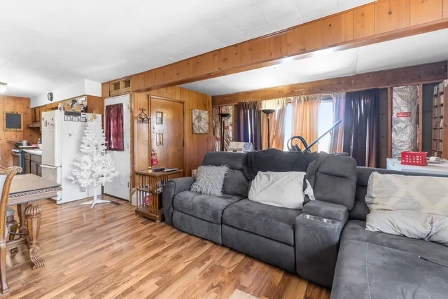 a kitchen with stainless steel appliances a refrigerator sink and white cabinets