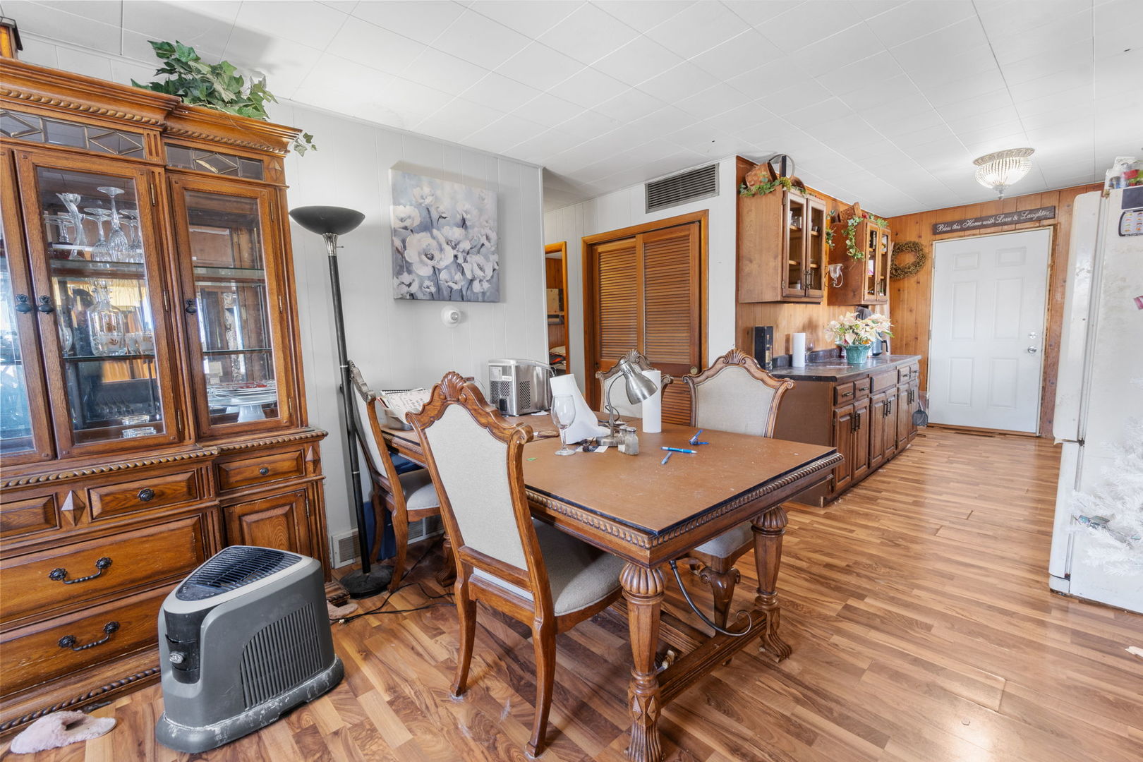 11505 Lakeview Road Richmond, IL 60071 - Photo 8 of 22 a view of a dining room with furniture window and wooden floor
