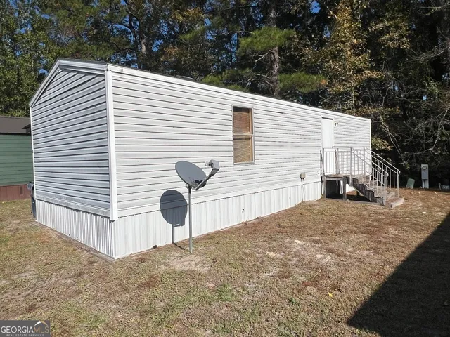 a view of a back yard of the house
