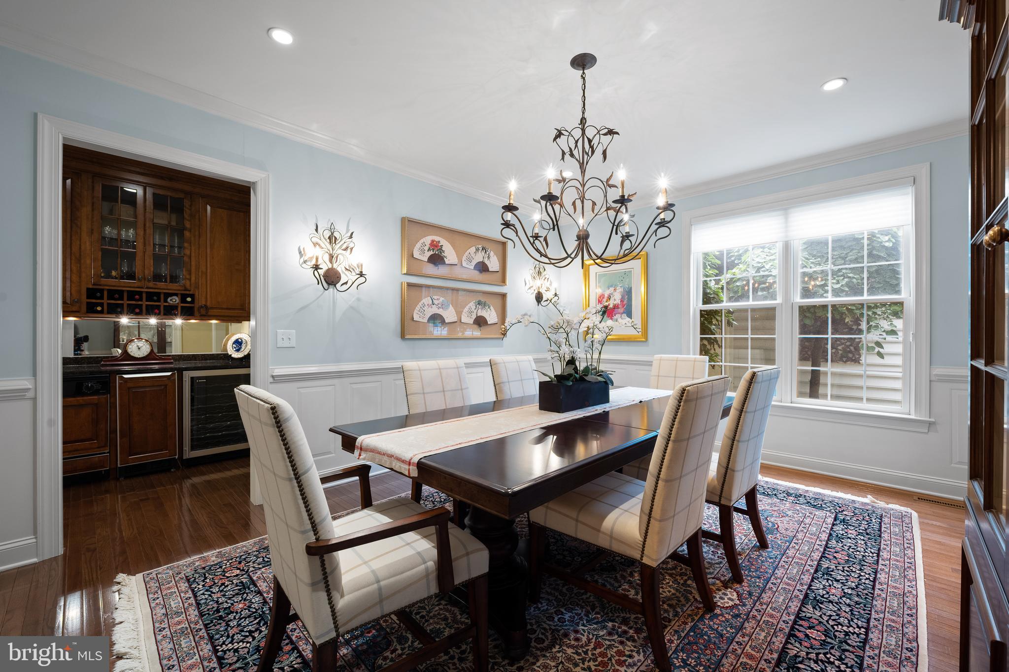 309 Applebrook Drive Malvern, PA 19355 - Photo 6 of 56 Full dining room with chandelier and wainscoting
