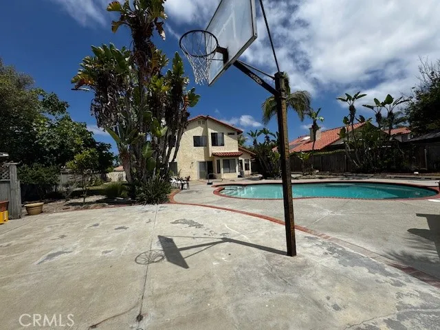 a view of a house with snow on the road