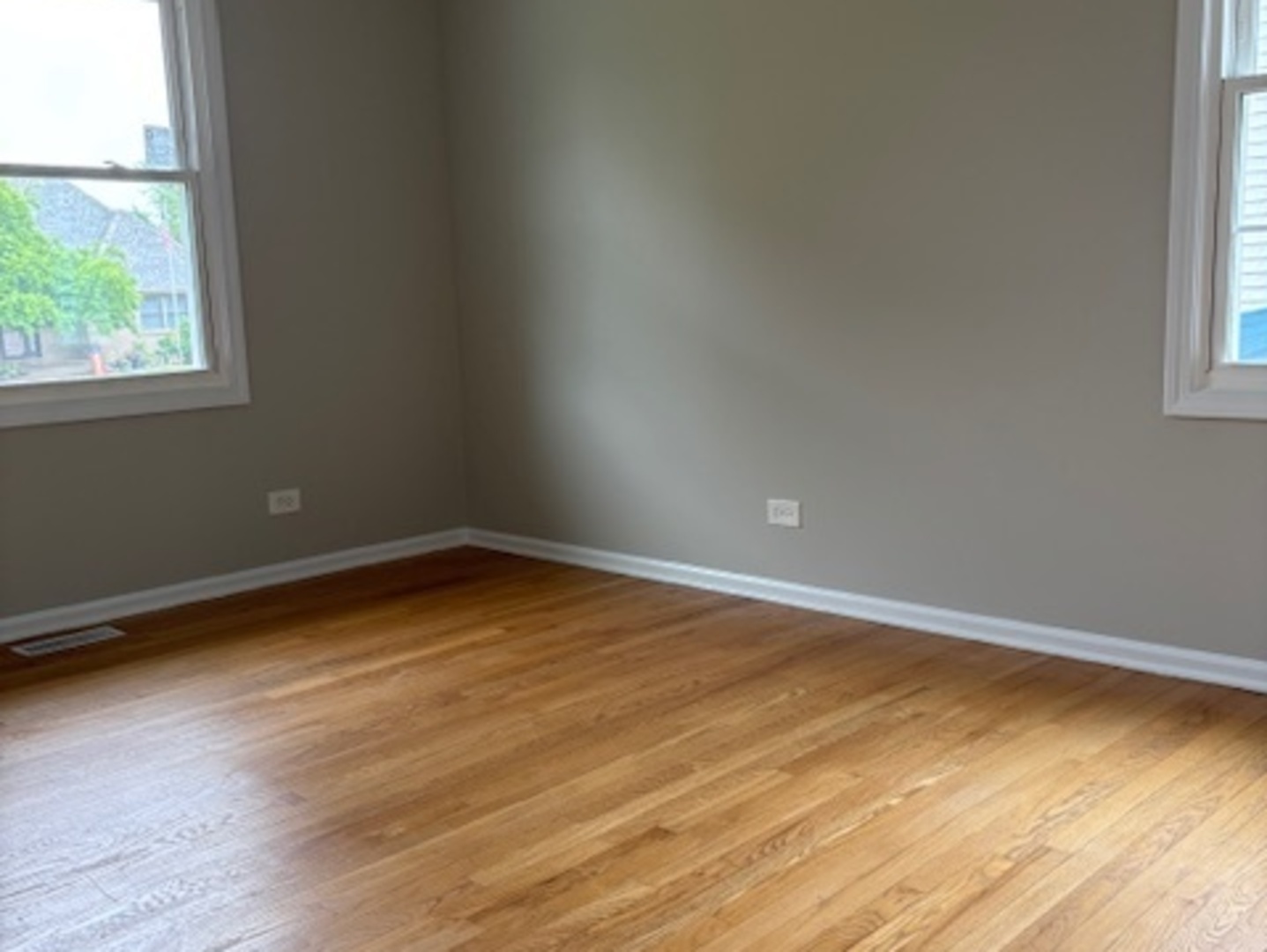 654 Longview Drive Antioch, IL 60002 - Photo 16 of 22 an empty room with wooden floor and windows