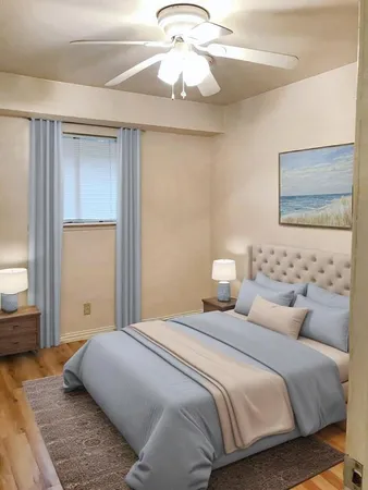 a bedroom with bed and window