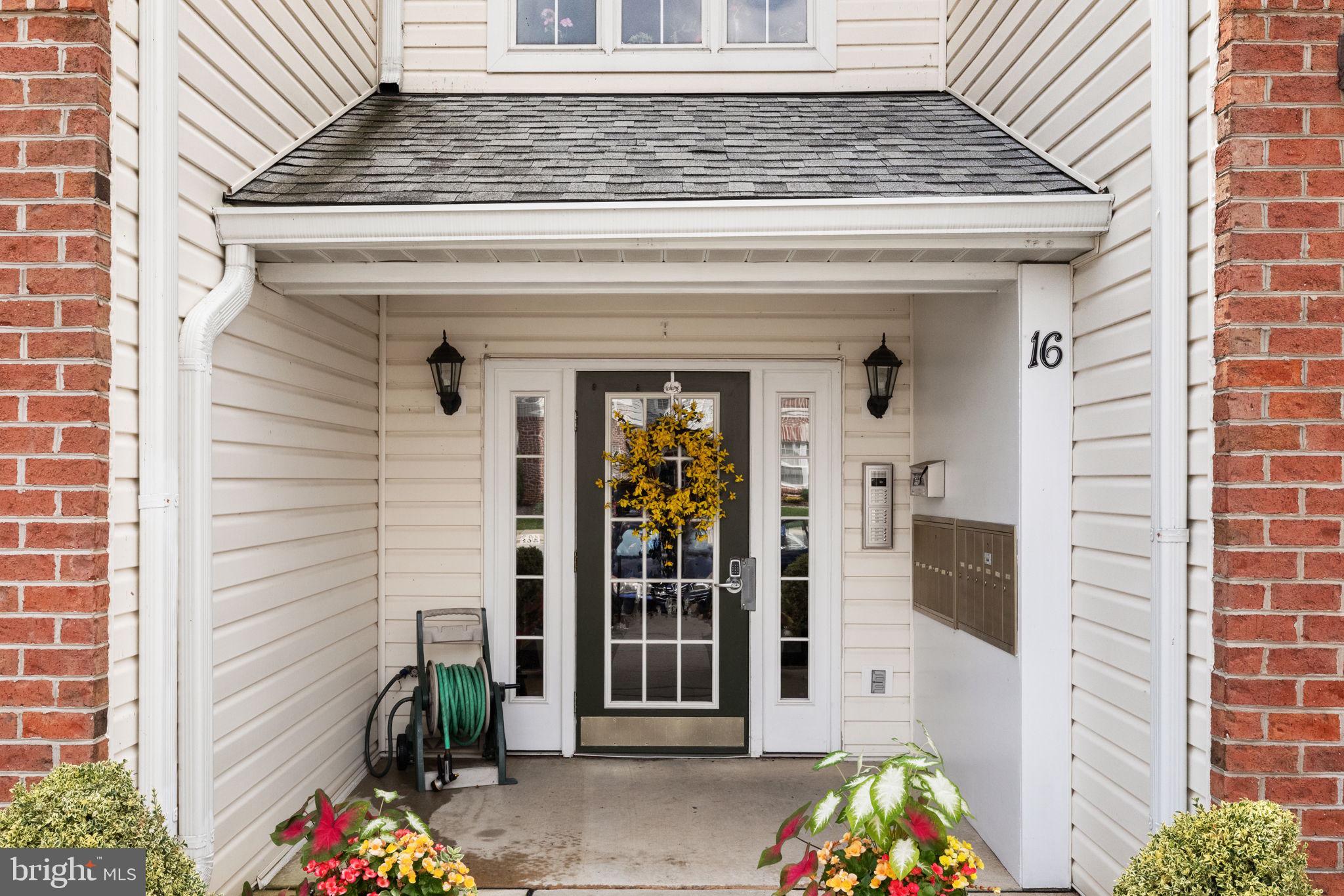16 Brook Farm Court, Unit 16D Perry Hall, MD 21128 - Photo 1 of 23 a front view of a house with a potted plant