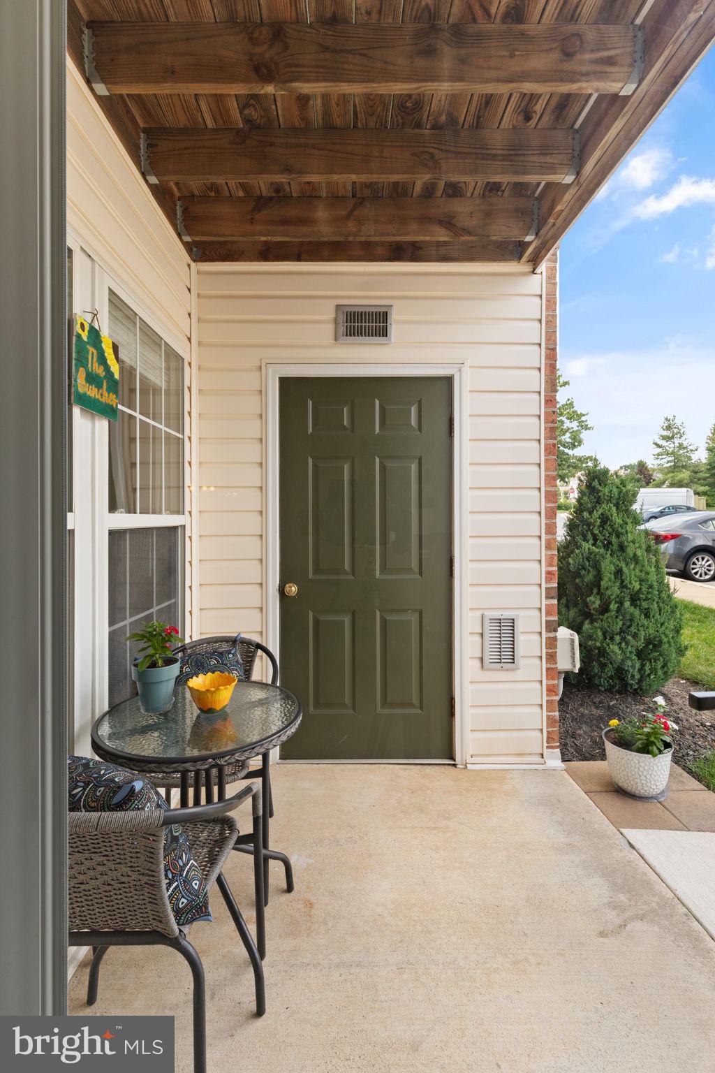 16 Brook Farm Court, Unit 16D Perry Hall, MD 21128 - Photo 20 of 23 a view of a chairs and table in the patio