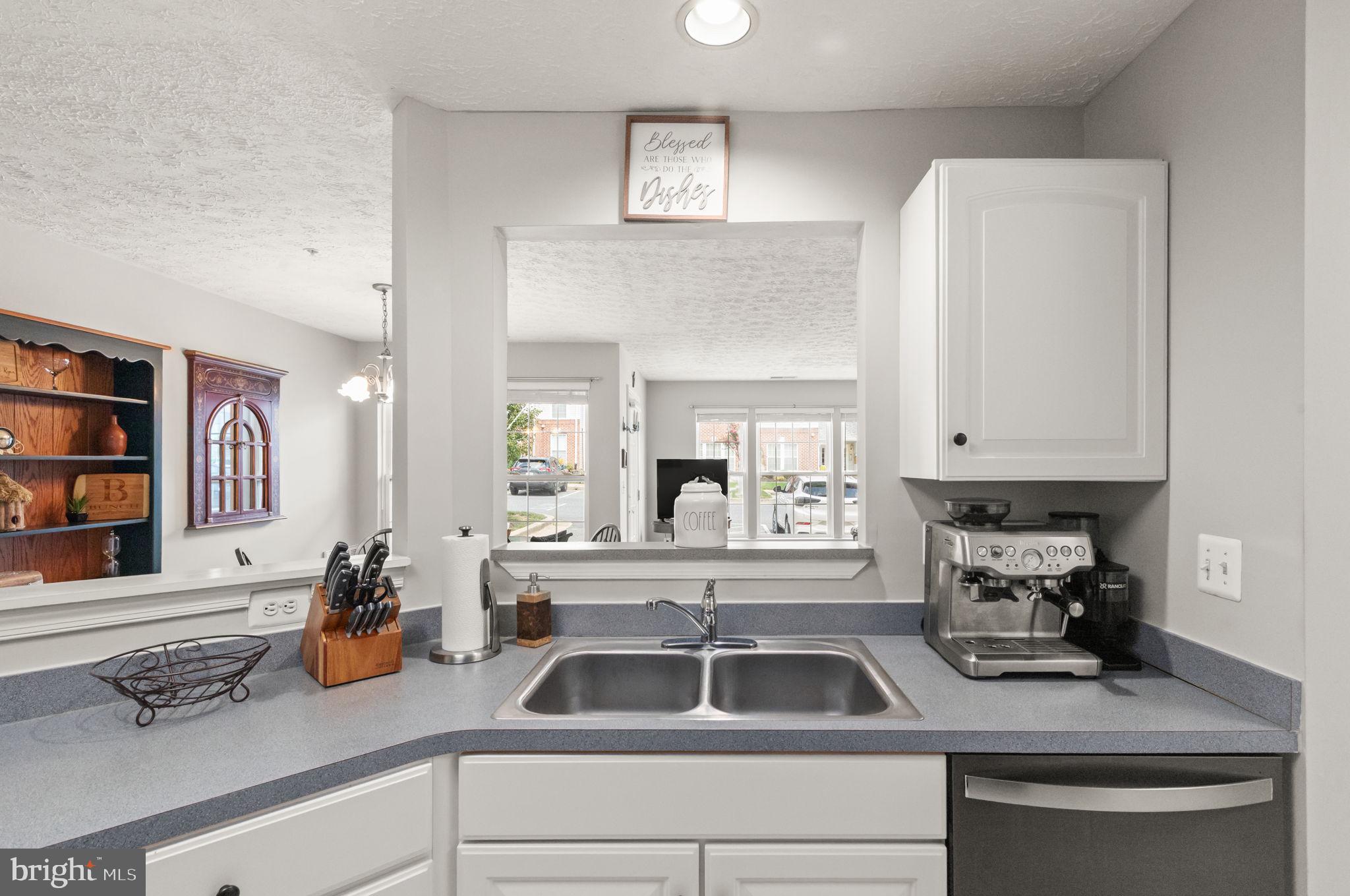 16 Brook Farm Court, Unit 16D Perry Hall, MD 21128 - Photo 5 of 23 a kitchen with a sink and a window