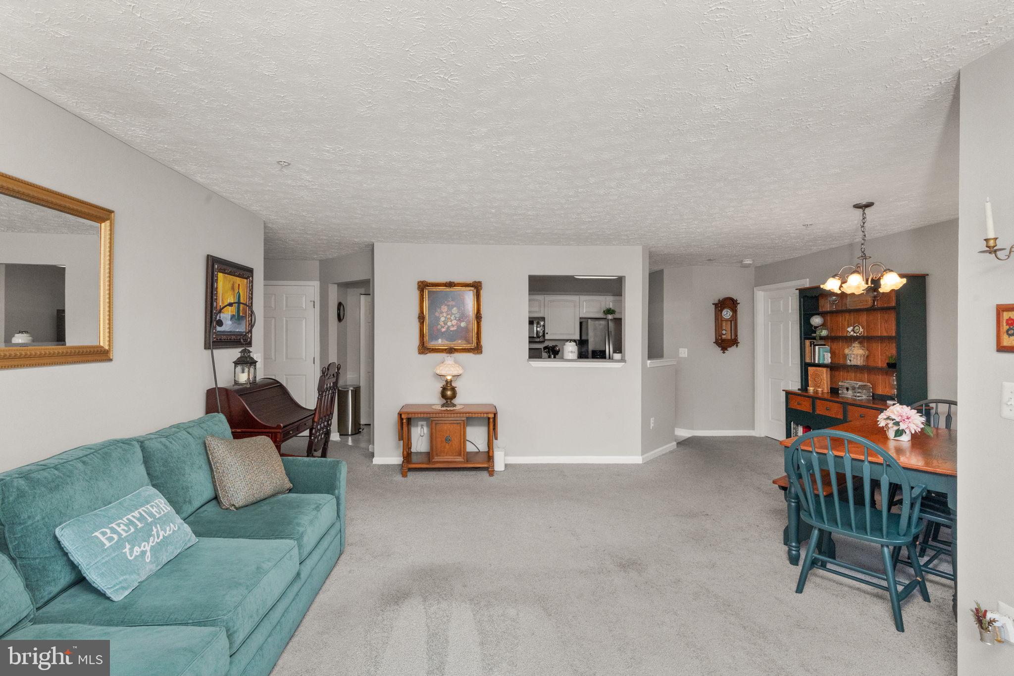 16 Brook Farm Court, Unit 16D Perry Hall, MD 21128 - Photo 8 of 23 a living room with furniture and a wooden floor