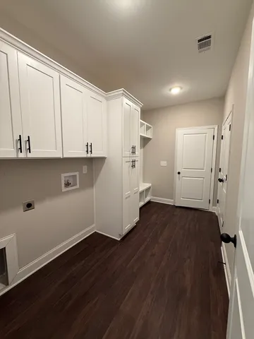 a view of a kitchen with electric appliances