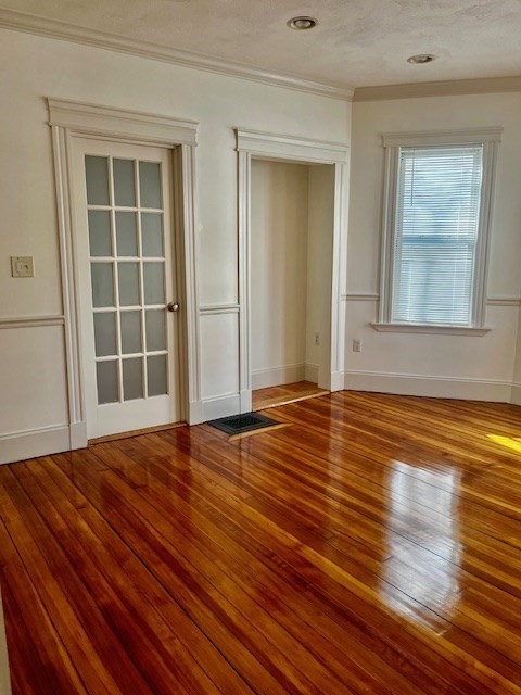 87 Bailey Street, Unit 1 Boston, MA 02124 - Photo 2 of 11 a view of empty room with wooden floor and window