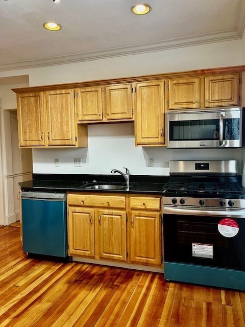 87 Bailey Street, Unit 1 Boston, MA 02124 - Photo 8 of 11 a kitchen with stainless steel appliances granite countertop a stove a sink and a microwave