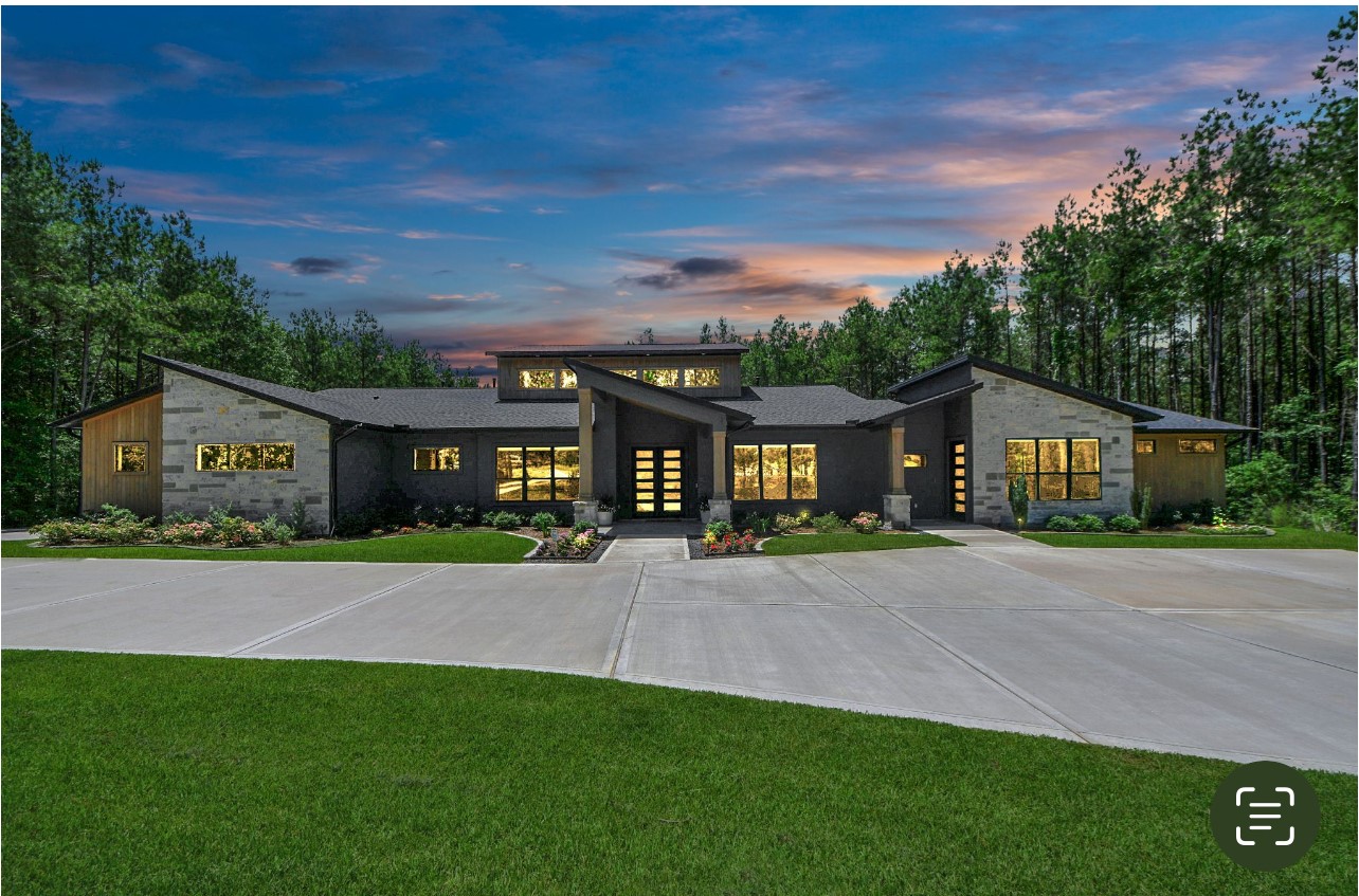 12784 Oak Barrel Road Willis, TX 77378 - Photo 2 of 28 a front view of a house with a yard and garage