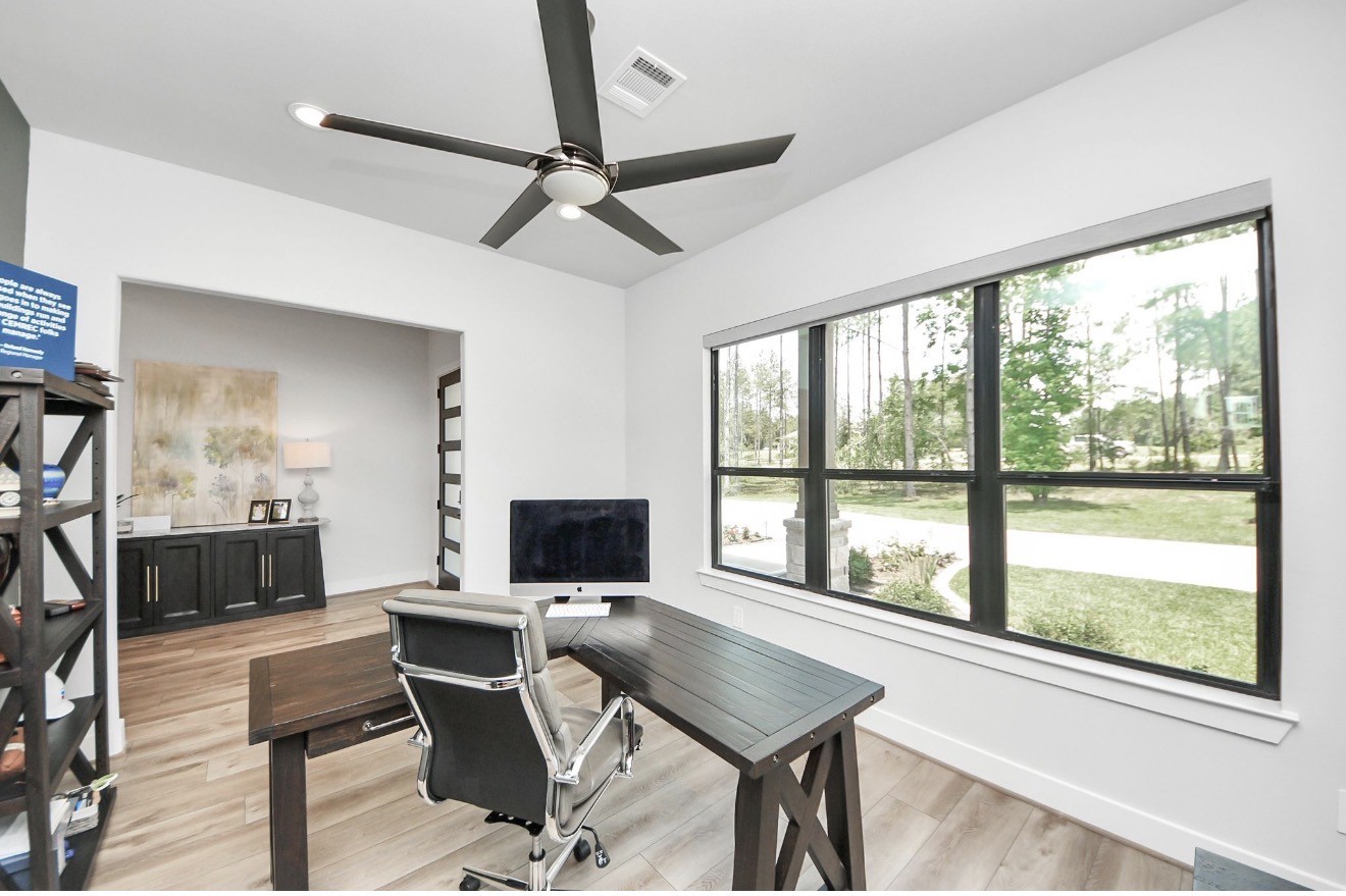 12784 Oak Barrel Road Willis, TX 77378 - Photo 21 of 28 a view of a workspace with furniture and a window