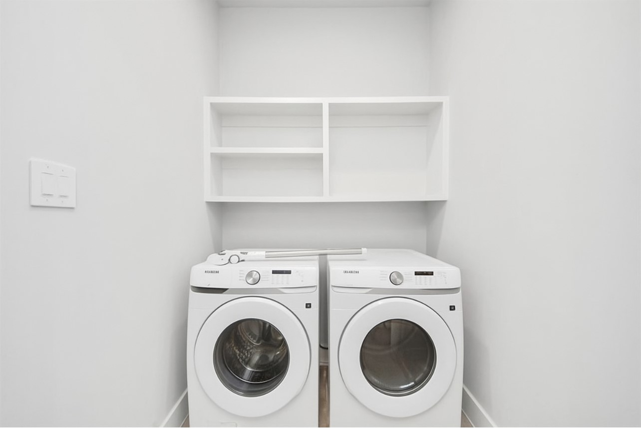 12784 Oak Barrel Road Willis, TX 77378 - Photo 26 of 28 a utility room with dryer and washer