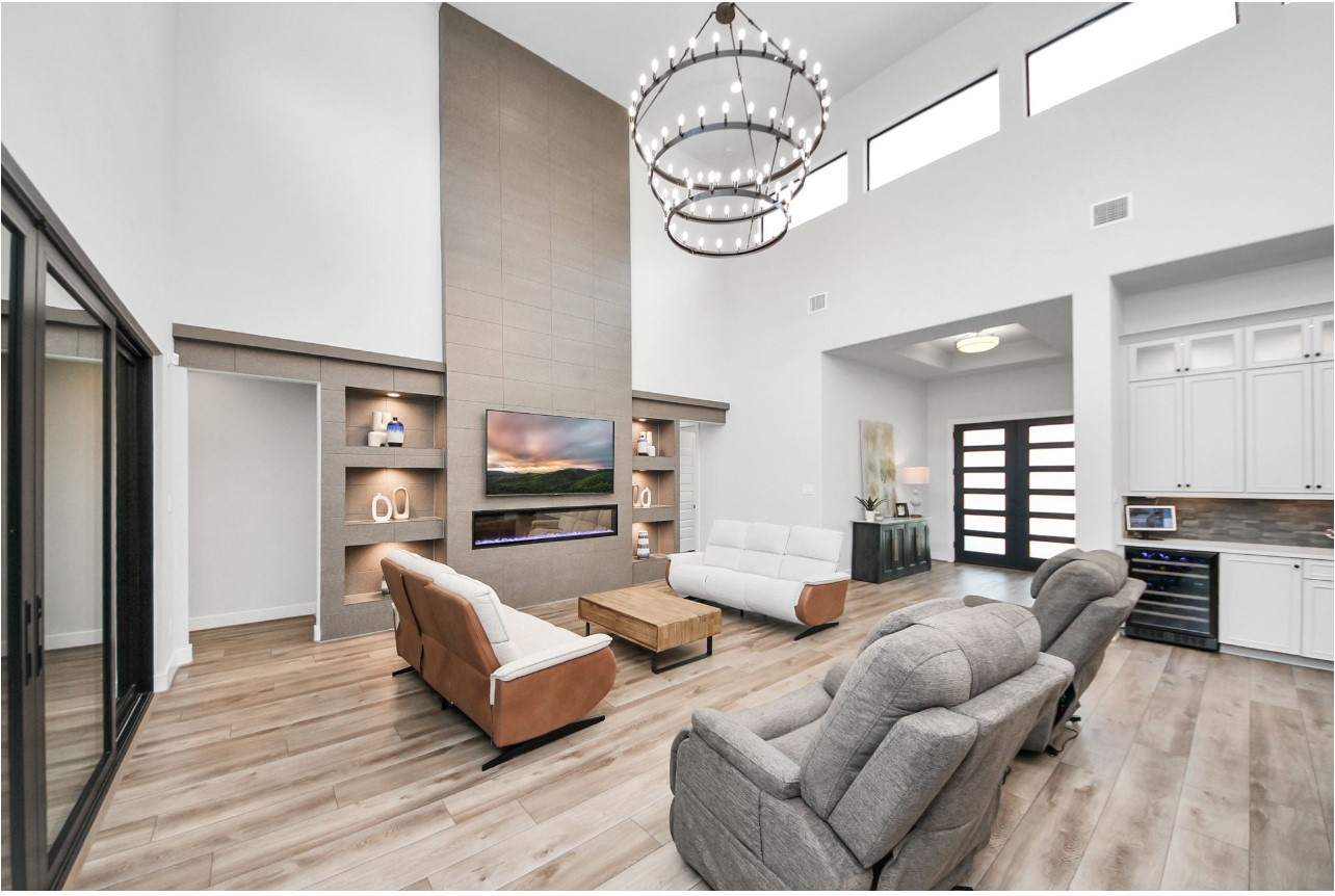 12784 Oak Barrel Road Willis, TX 77378 - Photo 9 of 28 a living room with furniture kitchen and a chandelier