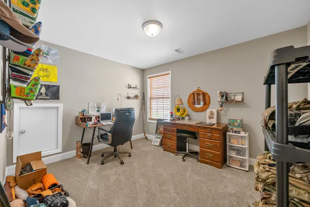 a view of a workspace with furniture and toys