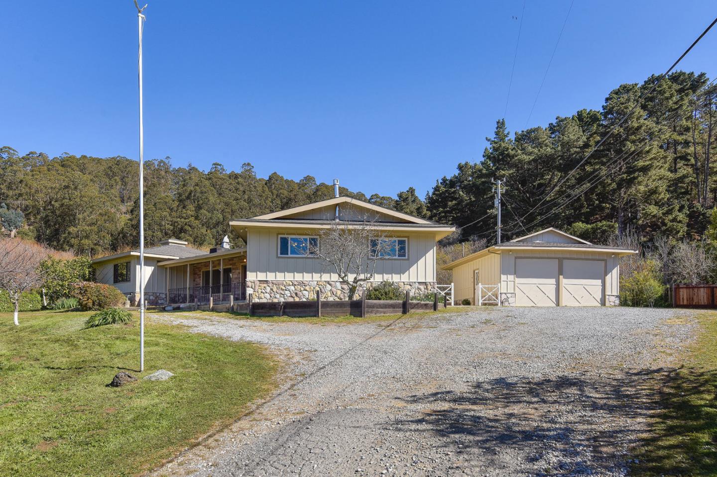 991 Zamora Drive Pacifica, CA 94044 - Photo 12 of 26 a front view of a house with a yard